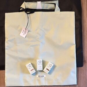 Prada Eau De Parfum set of 3 and light green tote bag.